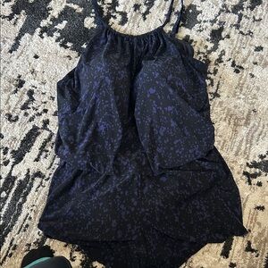 Stylish Black and purple bathing suit, one piece.